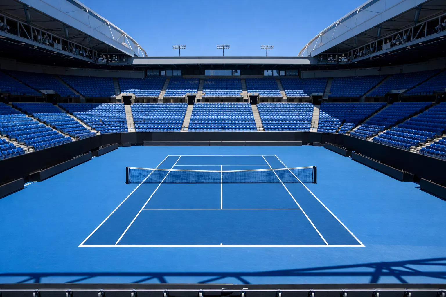 Pista de tenis dura azul del Australian Open con estadio Melbourne Park